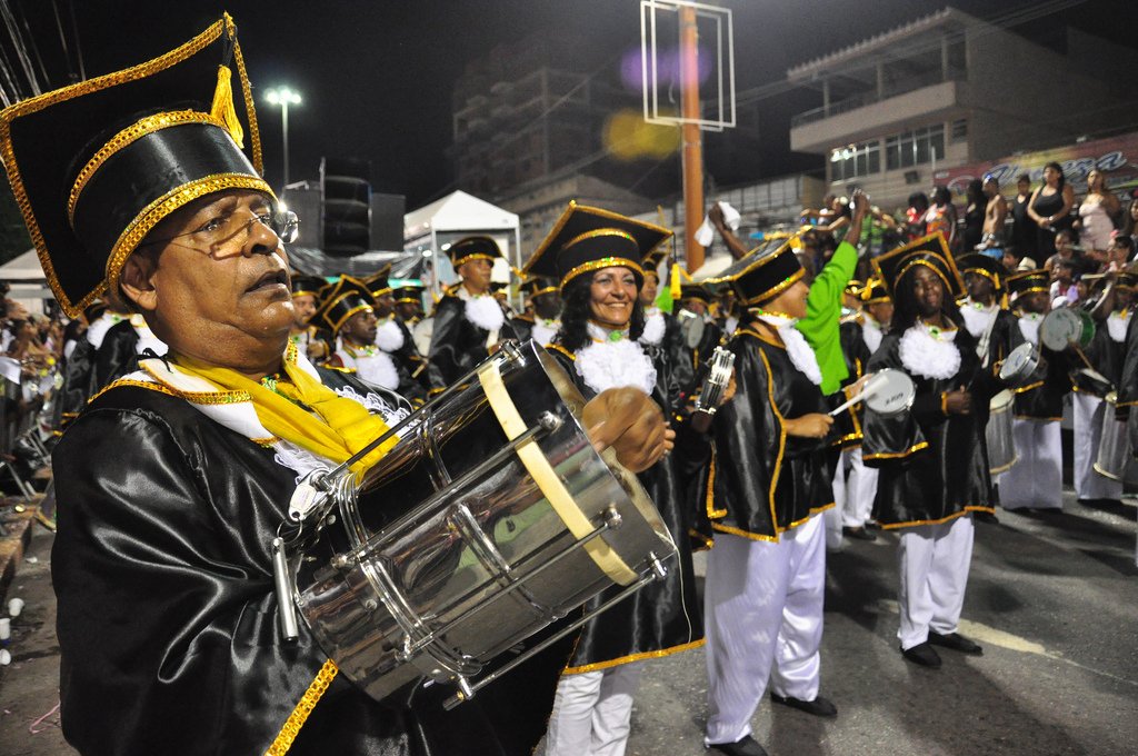 A surdo drummer from a samba school bateria playing during a Rio Carnival parade